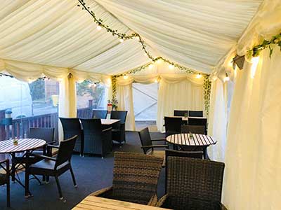 Socially distanced restaurant inside a frame tent