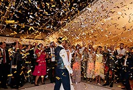 Bride and groom dance in a shower of glittery confetti