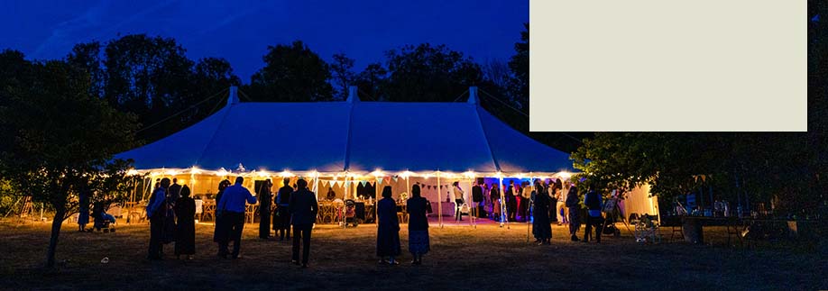 Relaxed style traditional tent lit up at night